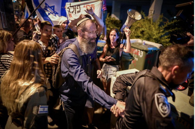 Left-wing protesters attack, pursue rabbi on Tel Aviv streets