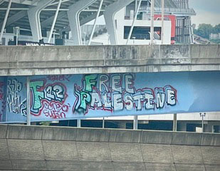 Criminal vandalism graffiti in front of Paycor Stadium 