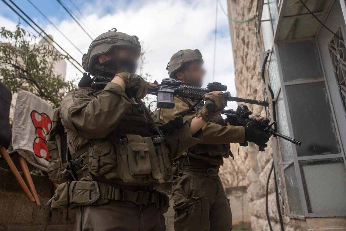 IDF arrests 14 terror suspects, seizes weapons in Hebron raid